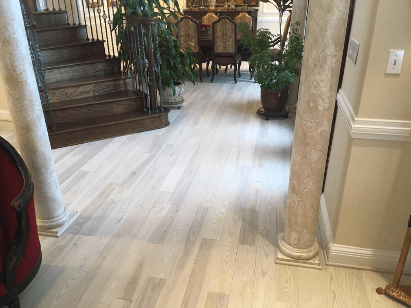 Creamy Hues of Ash Hardwood Flooring Blend Nicely with the Rest of the Home